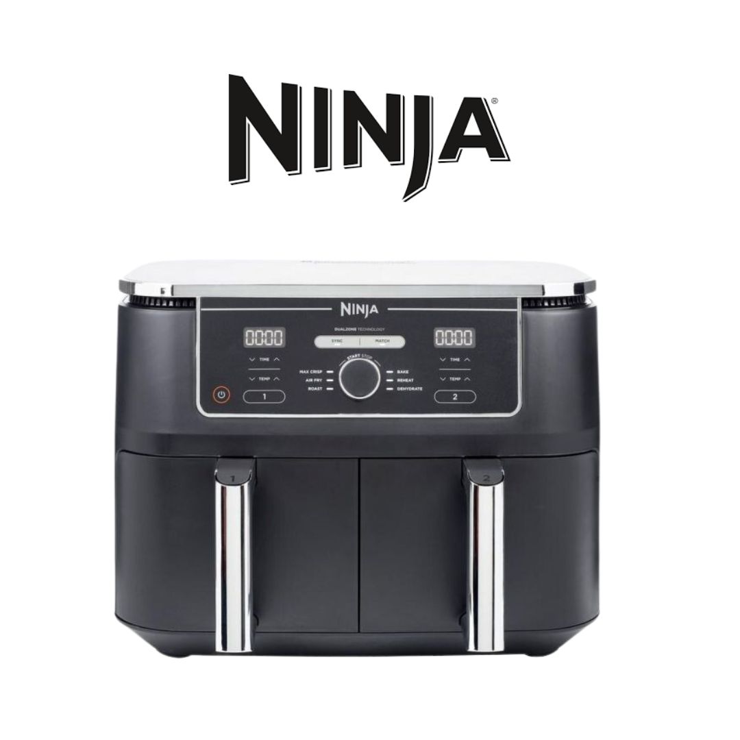 A sleek, modern Ninja Dual Zone Air Fryer with a matte black finish, featuring two separate cooking compartments with digital controls above each zone. The LED display shows cooking times and temperatures. The appliance has silver accents and touch-sensit